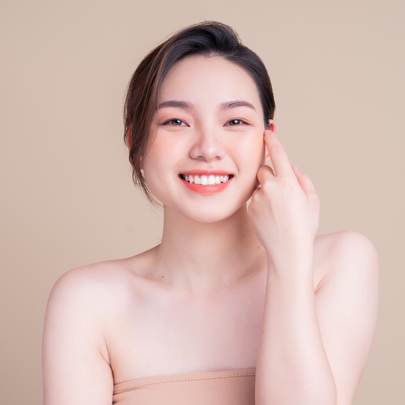 woman with clear skin smiling-